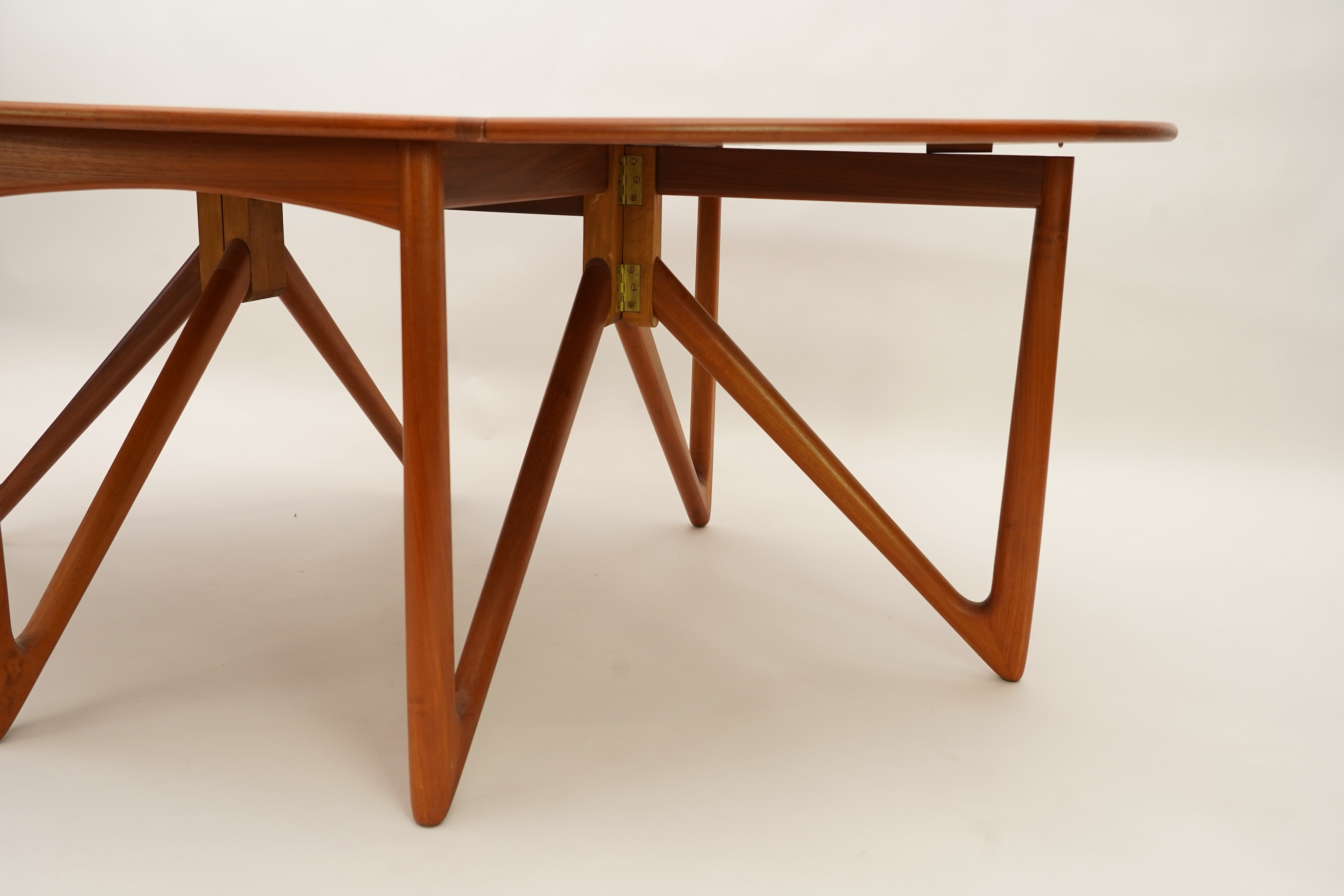 Niels Koefoed (Danish, b. 1929) for Koefoeds Møbelfabrik: A teak 'Oval Klap' dining table